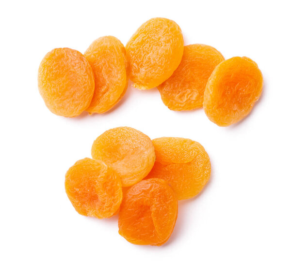 Group of yellow dried apricots isolated on white background.