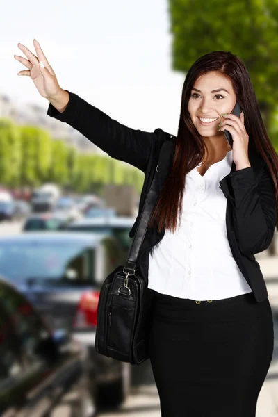 Businesswoman Getting Taxi — Stock Photo, Image