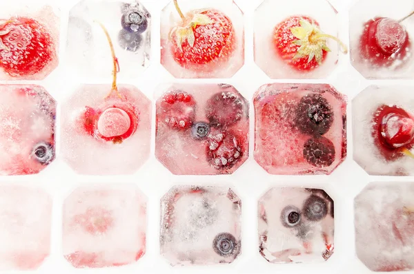 Summer berries in ice Stock Picture