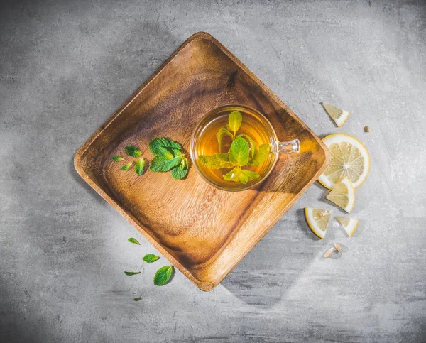Mint Tea Leaves Cup Wooden Saucer Slice Lemon Gray Table — Stock Photo, Image