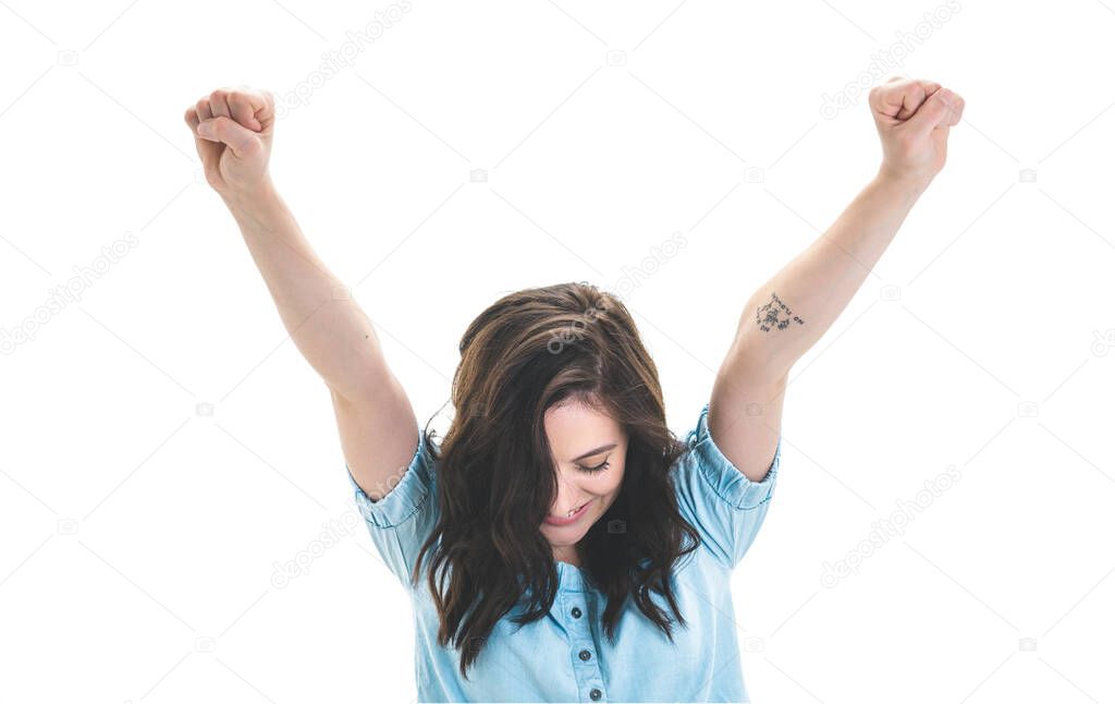 Victory. Young woman looking down with wide opened arms, girl celebrates his success, isolated on white background. Studio shot