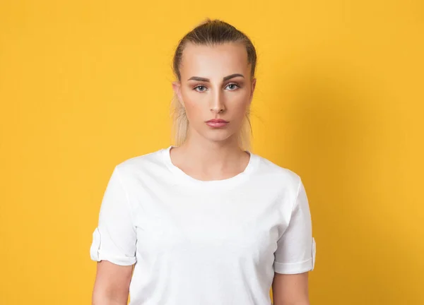 Serious Young Woman Wears White Shirt Looking Camera Isolated Yellow — Stock Photo, Image