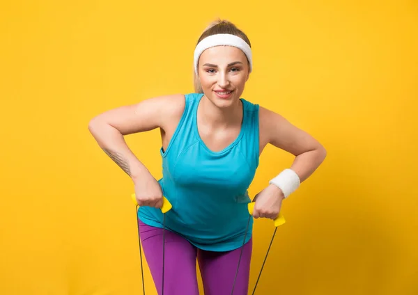 Fitness Woman Performs Exercises Muscles Hands Resistance Band Isolated Yellow — Stock Photo, Image