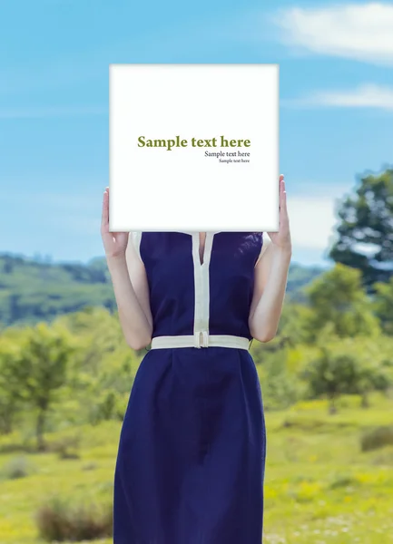 Female showing blank panel over her face — Stock Photo, Image