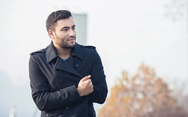 Young man in a coat — Stock Photo, Image