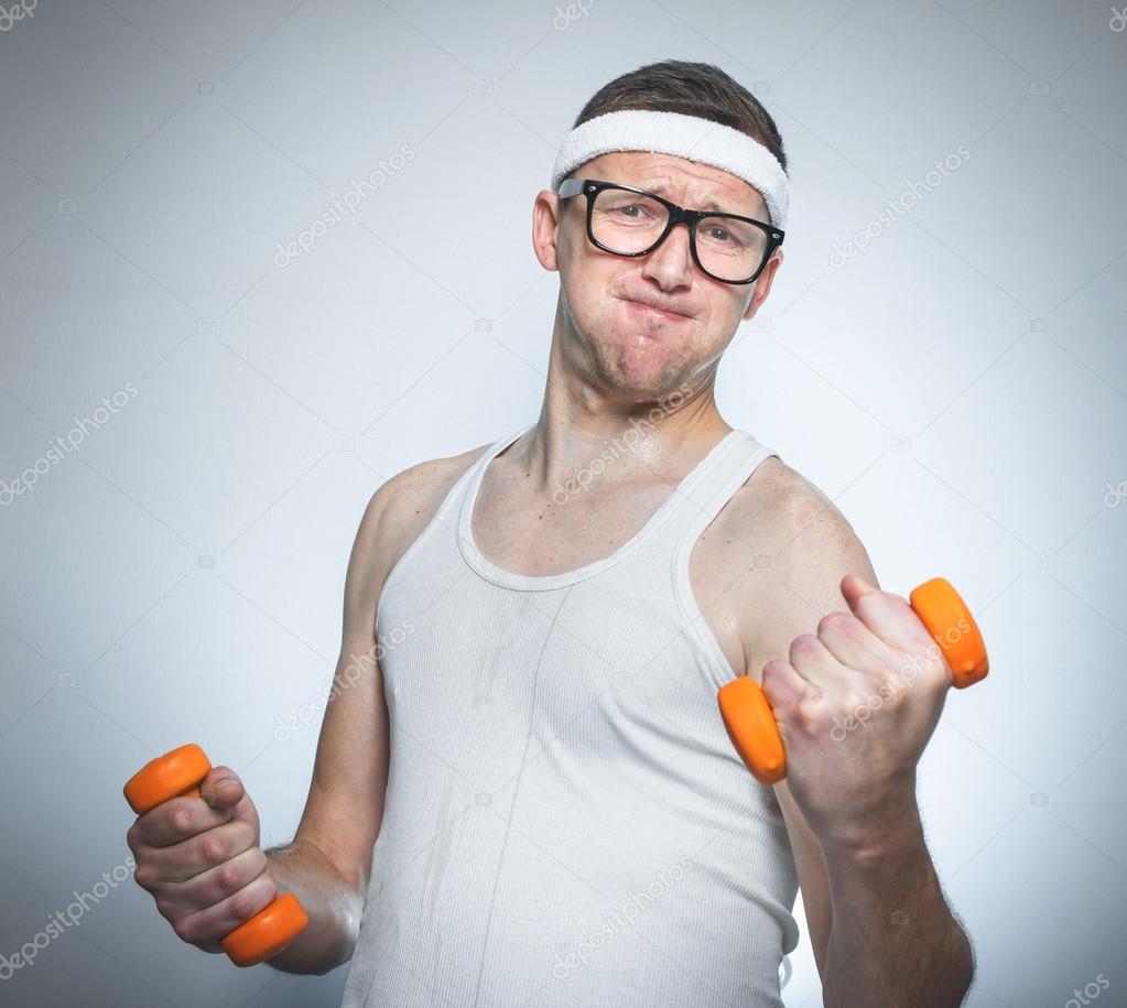 Funny weak man lifting biceps