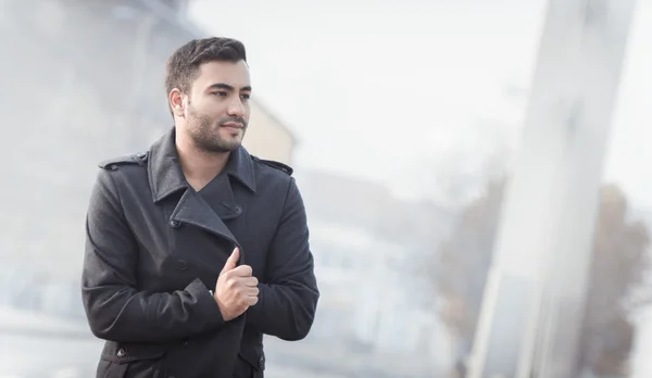 Young man in a coat — Stock Photo, Image