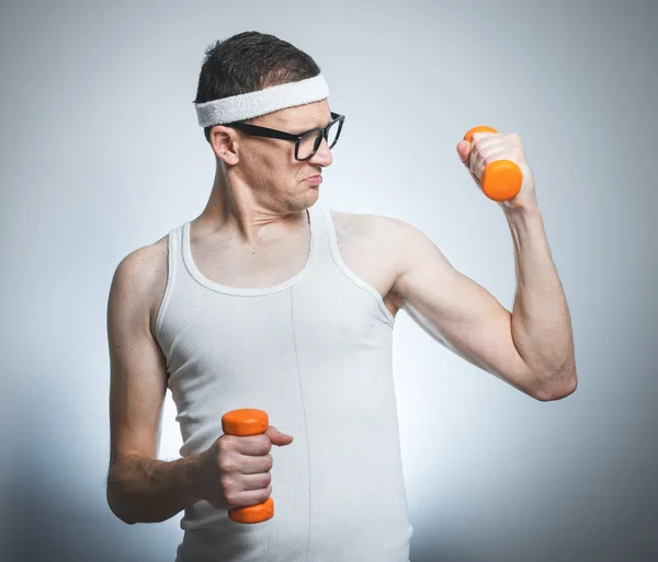 Nerd lifting his biceps — Stock Photo, Image