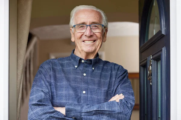 Portrait Smiling Senior Man Standing Open Front Door House — Stock Photo, Image