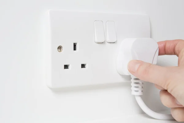 Hand Putting Plug Into Electricity Socket — Stock Photo, Image