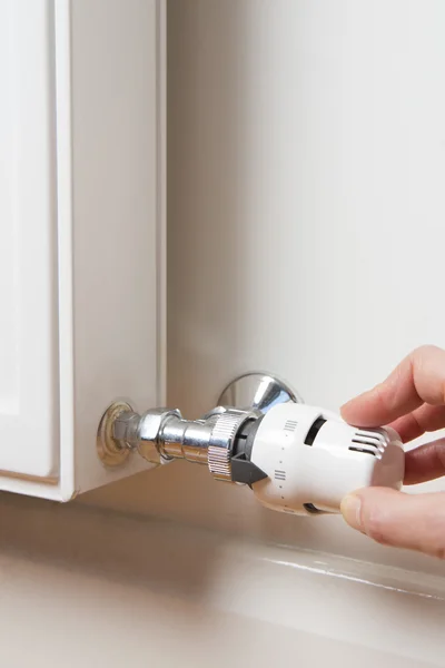 Close Up Of Hand Adjusting Radiator Thermostat — Stock Photo, Image