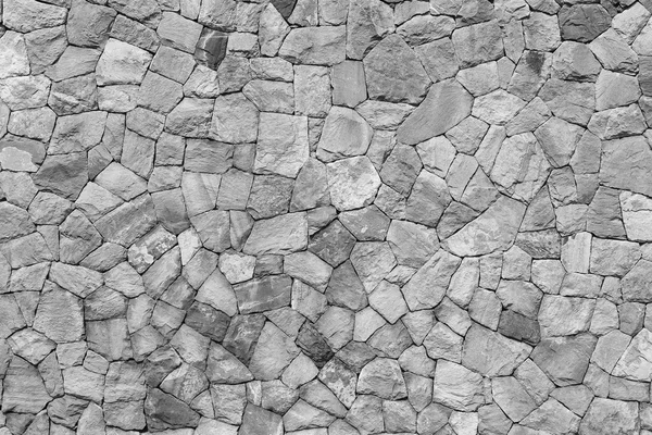 Textura foto de pared de piedra hecha de rocas de montaña en blanco negro —  Fotos de Stock
