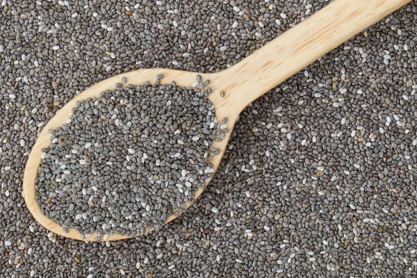 Top view of wooden spoon full of dried Chia seeds (Salvia hispanica) — Stock Photo, Image