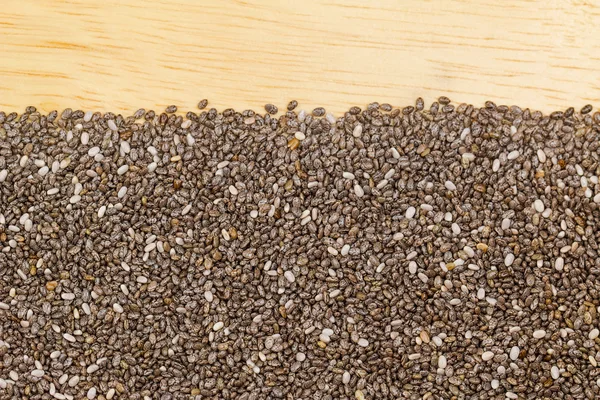 Dried Chia seeds on wooden background with copyspace — Stock Photo, Image