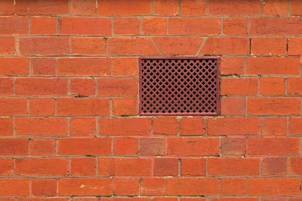 Foto van de textuur van rode bakstenen muur met ontluchter, ventilatio — Stockfoto
