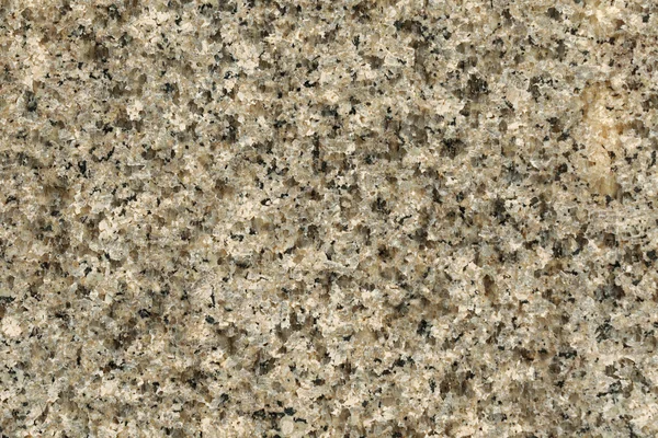 Texture of polished granite rock in gray black. Background of natural stone pattern