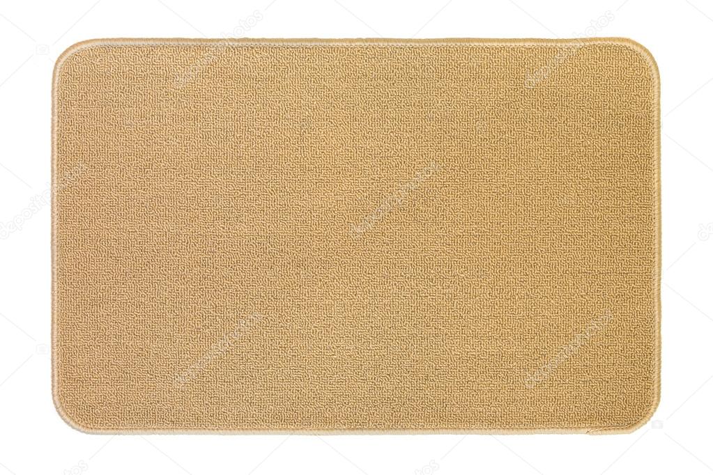 New and clean floor rug, doormat in beige color isolated on white