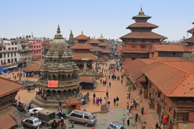 Tourists and local people visiting Patan Durbar Square in Patan, Nepal clipart