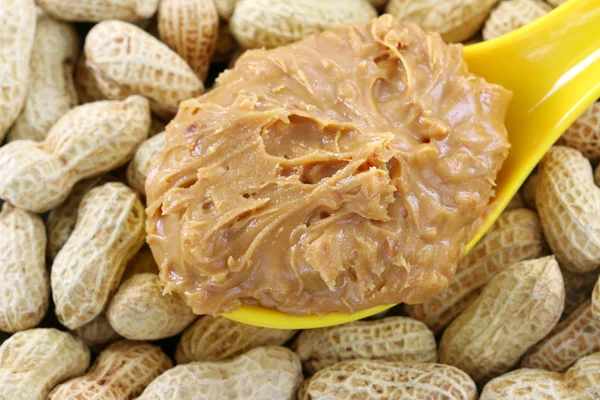 Crunchy peanut butter on peanuts — Stock Photo, Image