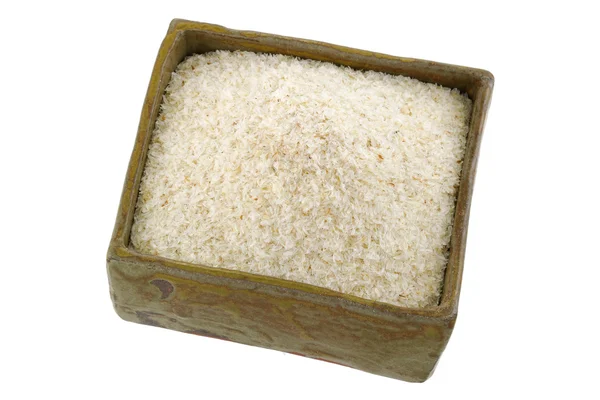 Een kwadraat klei kom vol met gedroogde psyllium kroonkafje vezel — Stockfoto