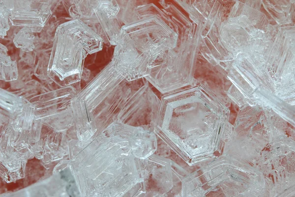 Macro photo of ice crystals on orange background — Stock Photo, Image