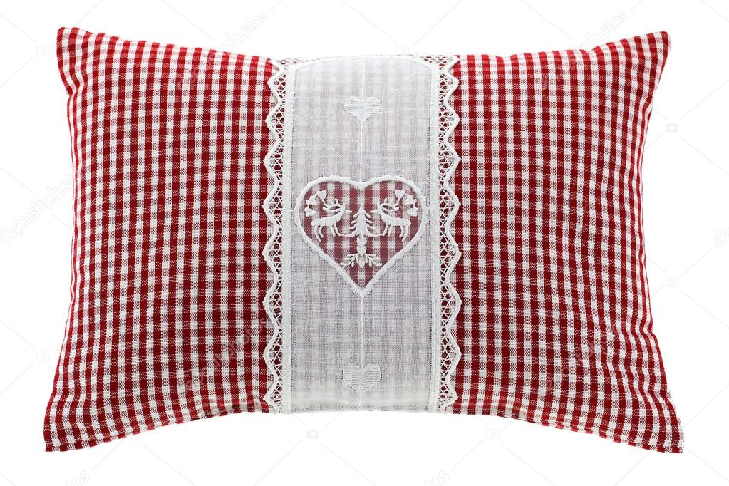 Red gingham pillow with flake of Swiss stone pine inside