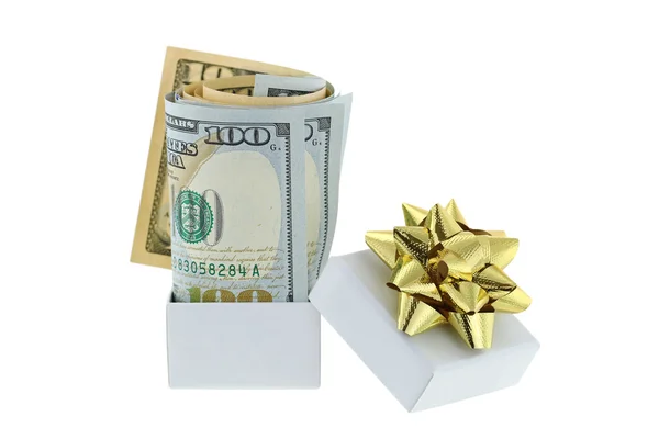 A white box with golden gift ribbon with new rolled United stated bills inside — Stock Photo, Image