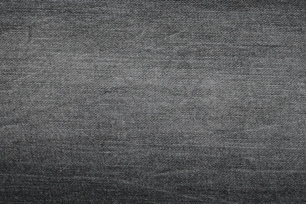 Background photo of texture of Dark grey denim jeans textile — Stock Photo, Image