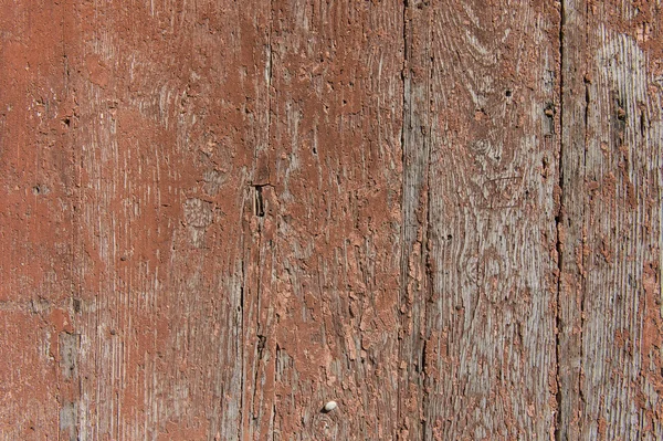 Old wooden planks with cracked paint reddish — Stock Photo, Image