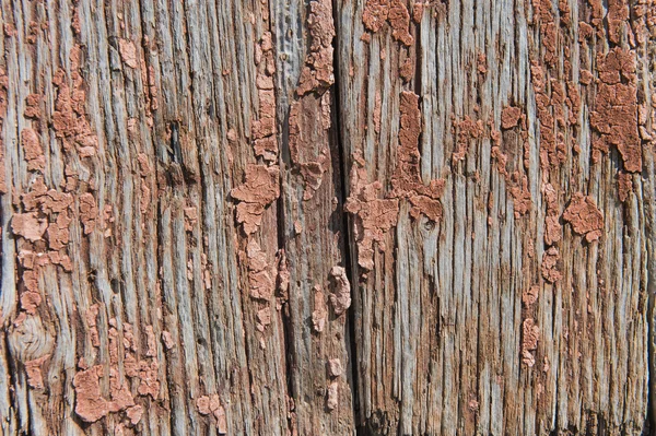Old wooden planks with cracked paint reddish — Stock Photo, Image