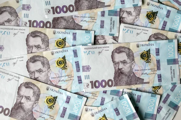 数千格里夫尼亚钞票的背景 密切关注金融背景 把钱上的手铐 乌克兰的腐败问题 — 图库照片