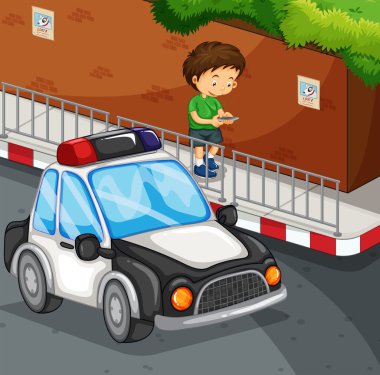 Çocuk sokakta cep telefonuna yazarak