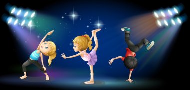 Three kids dancing on the stage clipart
