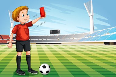 Hakem gösteren kırmızı kart futbol sahası