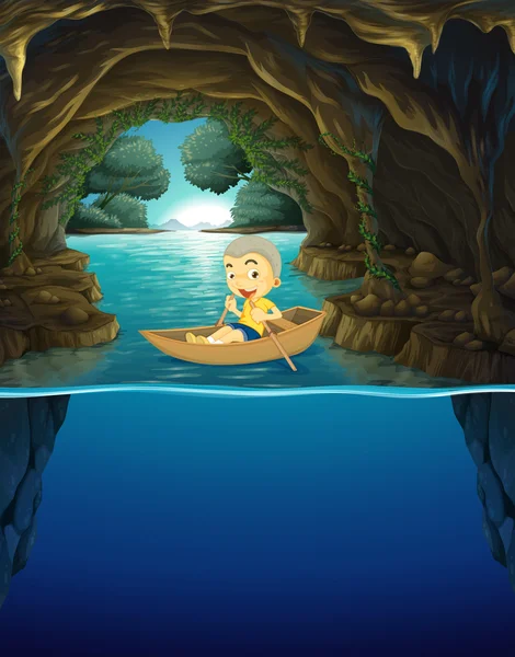 Little boy rowing boat in the cave