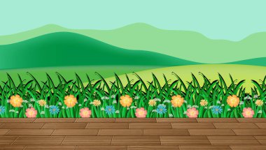 Çiçek tarlası ve dağ manzaralı yeşil çimenler.