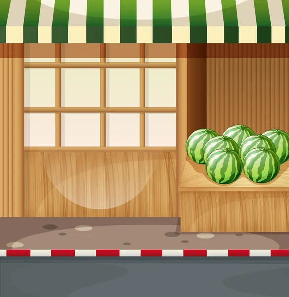 Watermelon in front of a shop — Stock Vector