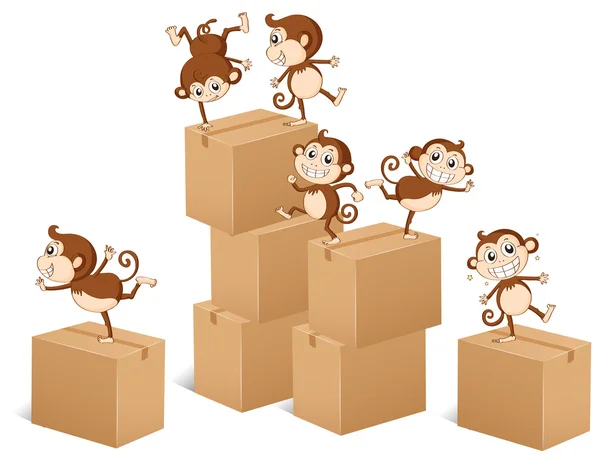 Monos subiendo por las cajas — Vector de stock