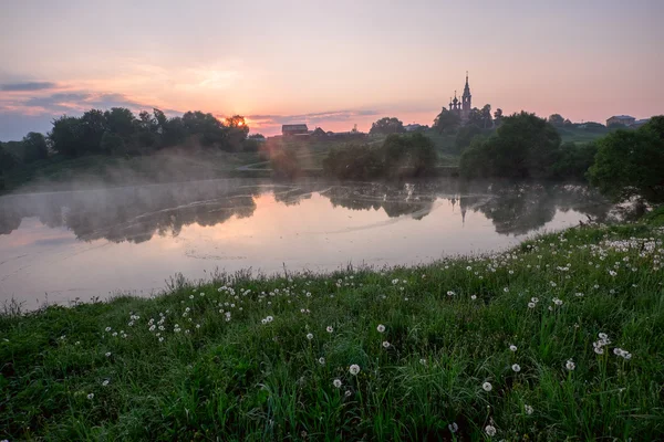 Early morning sunrise over village — 图库照片