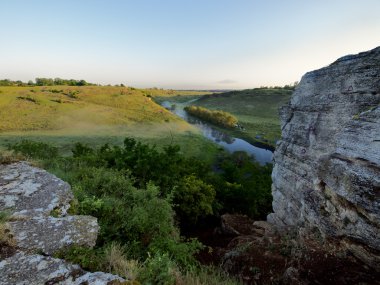 River in ravine on sunrise.