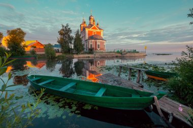 Wooden boat and church