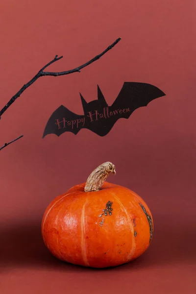 Halloween spooky symbol of vampire bat silhouette against brown background