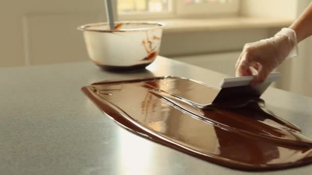 Melted Dark Chocolate mixing on a table Video Footage HD 1080p. — Stock Video