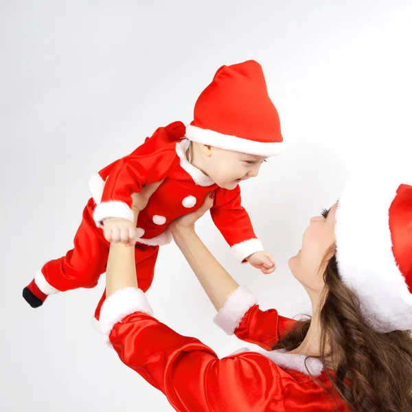 Mãe e bebê vestido de Natal Santa — Fotografia de Stock