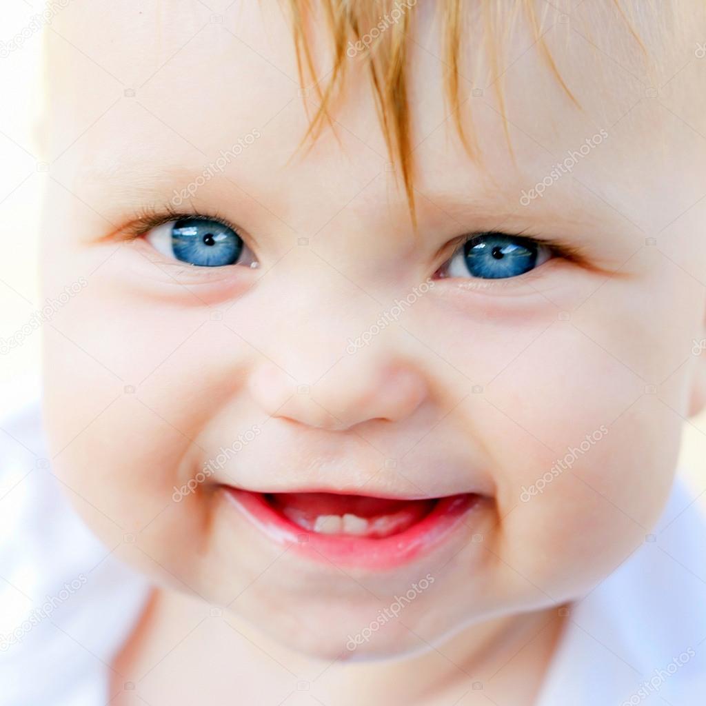 Smiling baby face close-up. Stock Photo by ©Vitalinka 53485781
