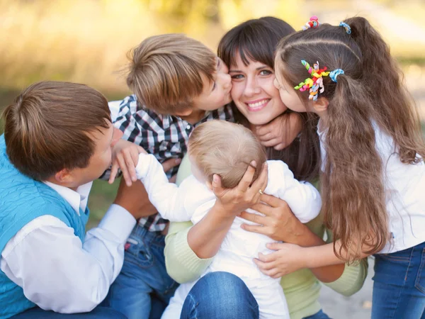 Large family hugging and having fun outdoors — Stock Photo, Image