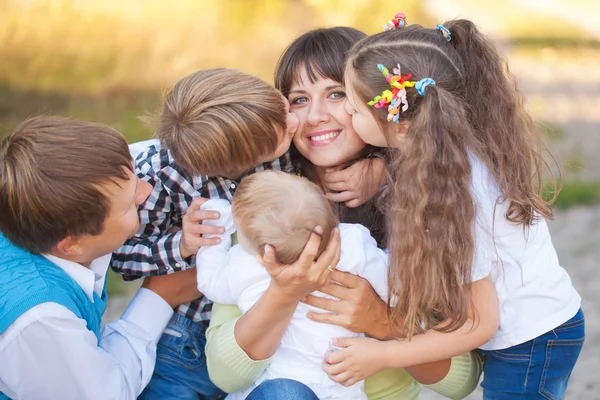 Large family hugging and having fun — Zdjęcie stockowe