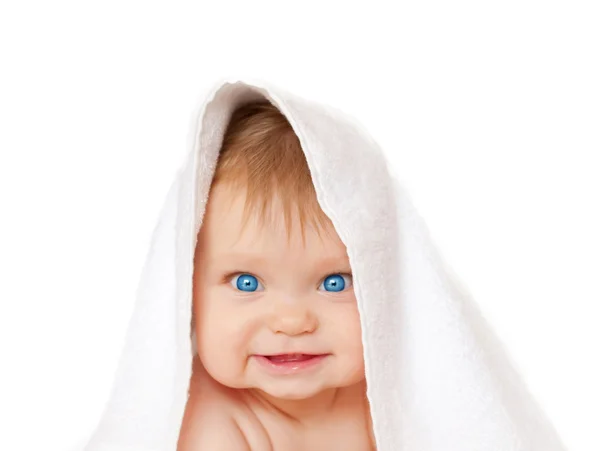 Blue-eyed baby under white towel — Stock Photo, Image