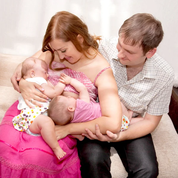 Breast-feeding twin babies at home. — Stock Photo, Image