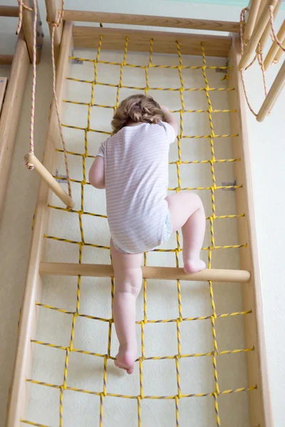 Baby toddler climbing up stairs. — Stock Photo, Image